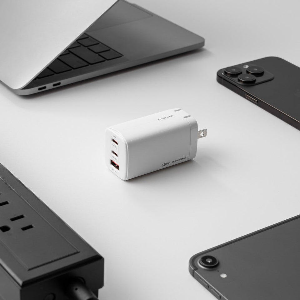 grantclassic 65W multi-port charger shown with a laptop, phone and tablet