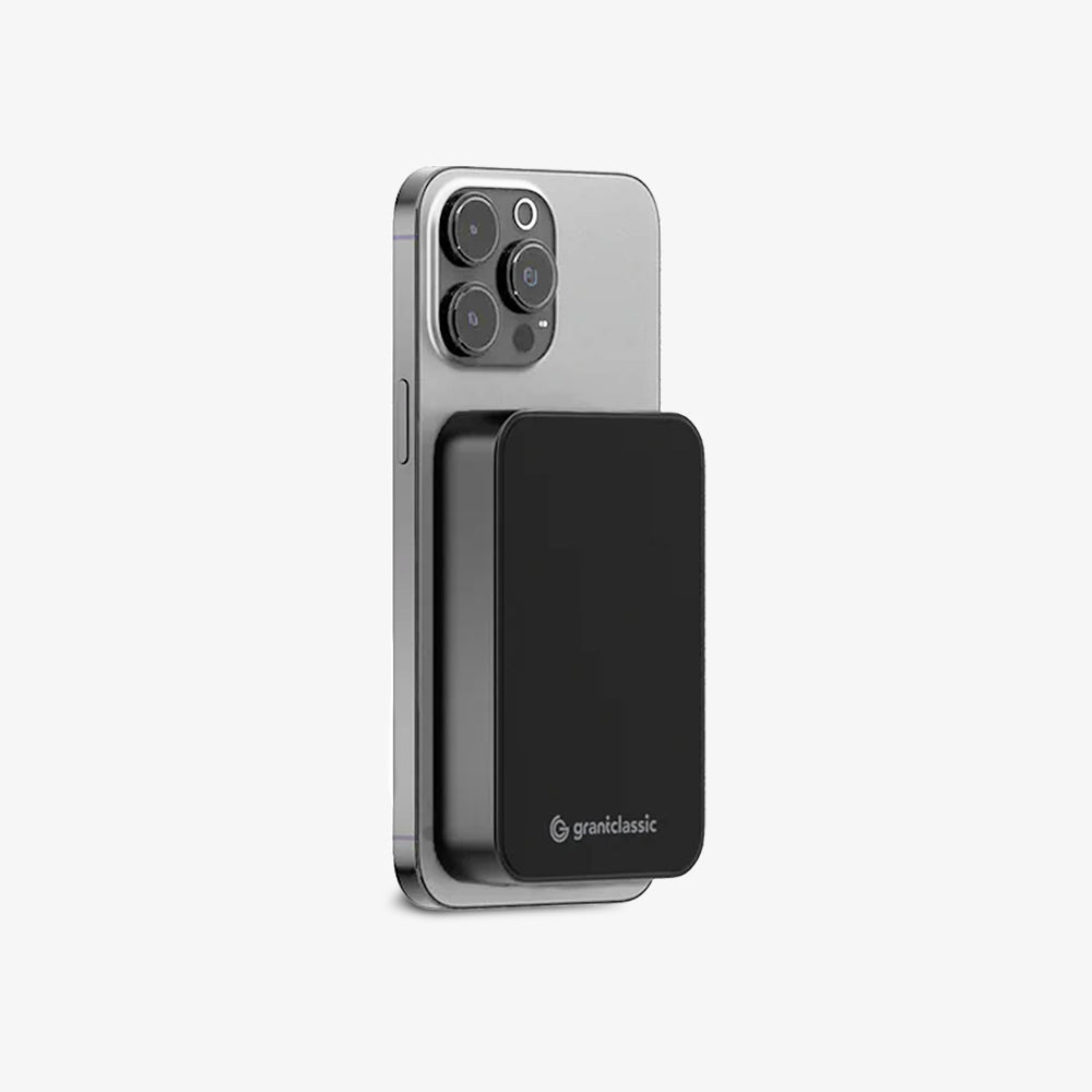 TITANSHIELD 10,000 mAh Solid-State Power Bank attached to the back of a phone | grantclassic