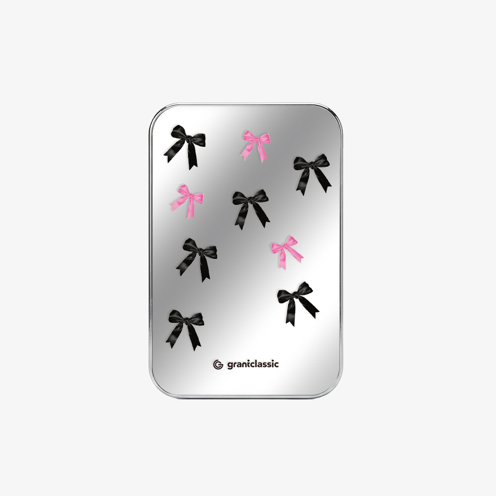 TITANSHIELD Solid-State Power Bank Mirror Edition on the back of an iPhone | grantclassic