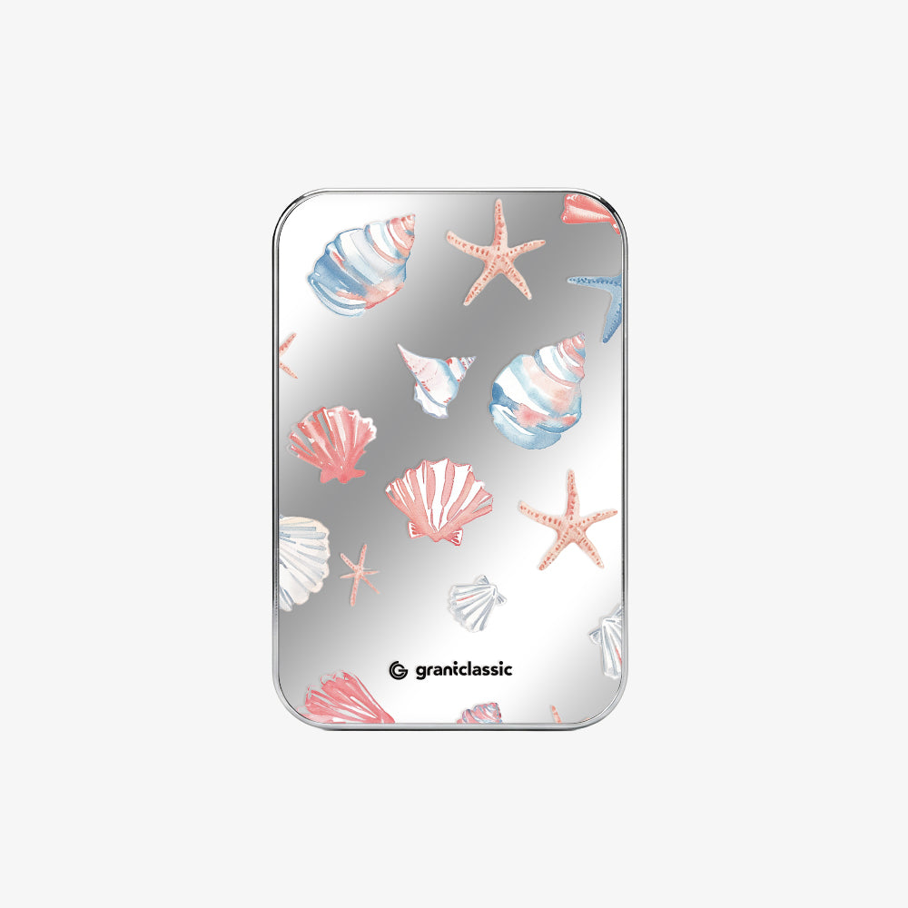 TITANSHIELD Mirror Edition, woman holding the Bow design power bank in a field under blue sky | grantclassic