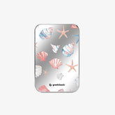 TITANSHIELD Mirror Edition, woman holding the Bow design power bank in a field under blue sky | grantclassic