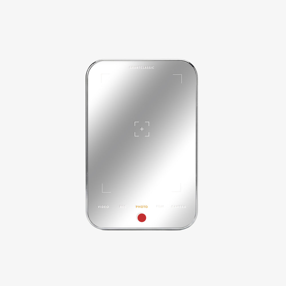 TITANSHIELD Mirror Edition, hand holding a phone and the power bank on a city street | grantclassic