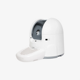 CatPalace automatic litter box, white egg-shaped body with step pedal, side view | grantclassic